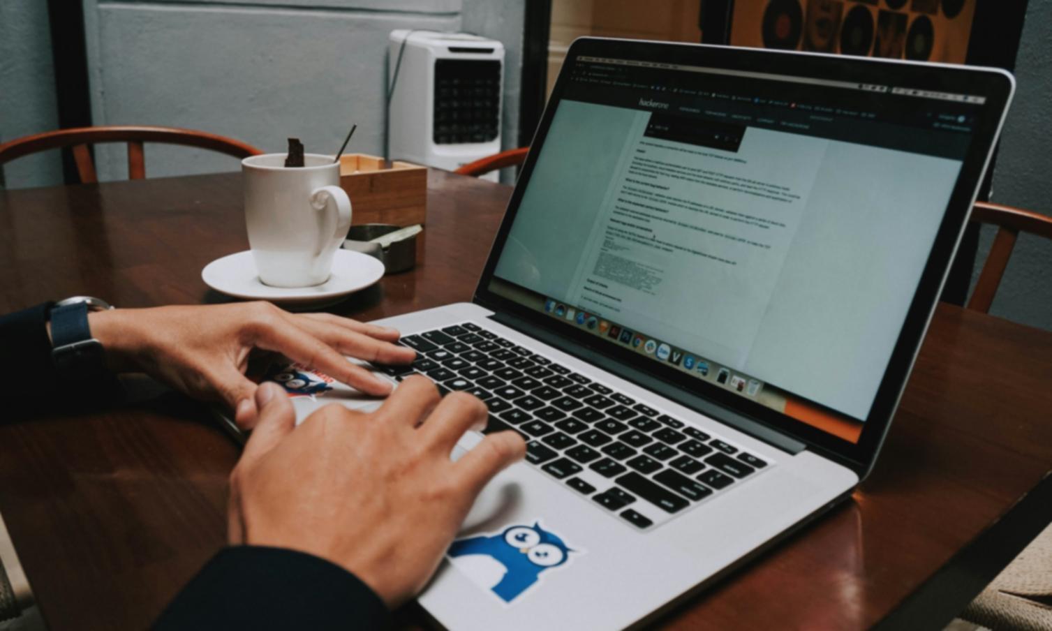 Early cybersecurity training session showing instructors working with financial professionals on threat detection